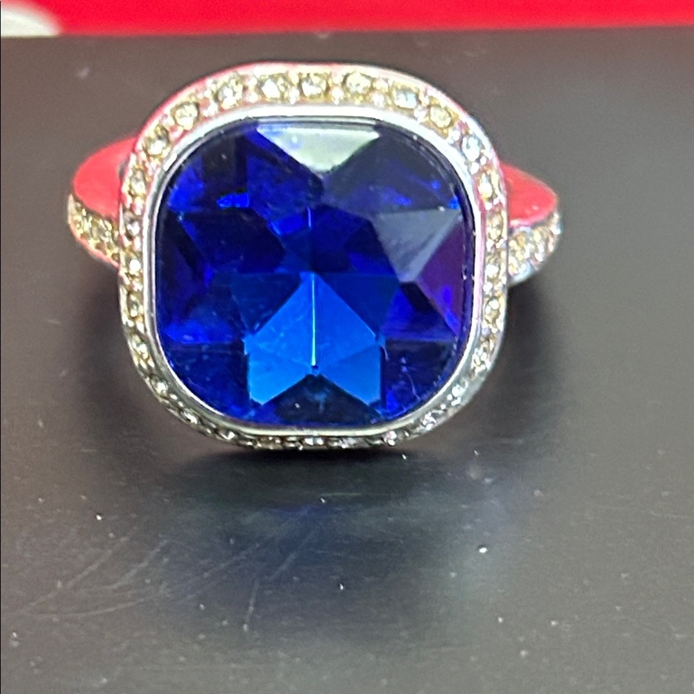 Elegant Silver Ring with Deep Blue Cushion Gem and Halo